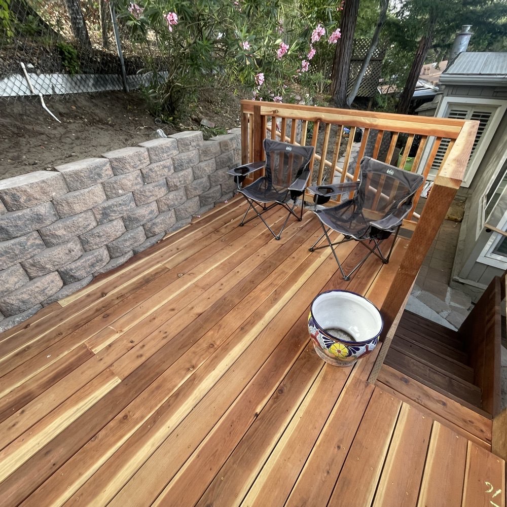 Cedar deck with a stone retaining wall